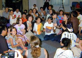 32 foreign disaster orphans arrive in Japan